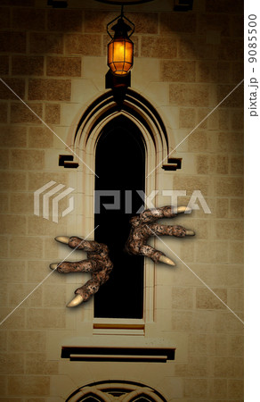 Paws of monster in castle window 9085500