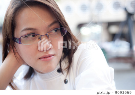 One woman is thinking something. One woman is thinking something. 9093669