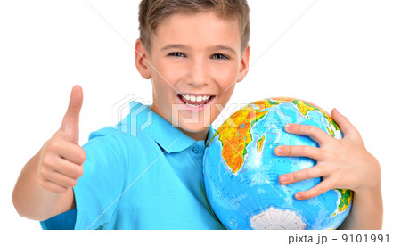 Smiling boy in casual  holding globe with thumbs up 9101991