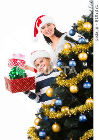 Happy mother with child hold box with gift Happy mother with child hold box with gift 9103381