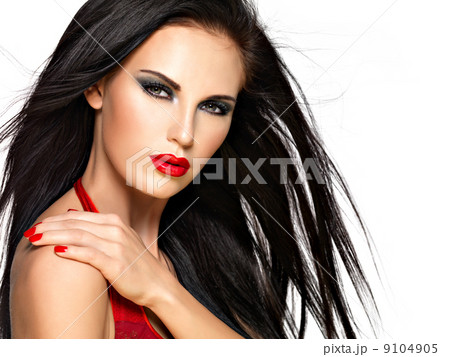 Face of a beautiful woman with red nails and lips 9104905