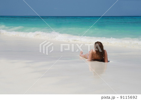 women sunbathing on beach women sunbathing on beach 9115692