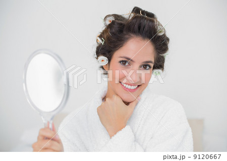 Gleeful natural brunette holding hand mirror Gleeful natural brunette holding hand mirror 9120667