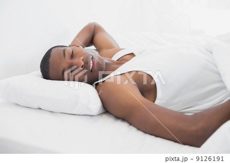 Afro man sleeping in bed Afro man sleeping in bed 9126191