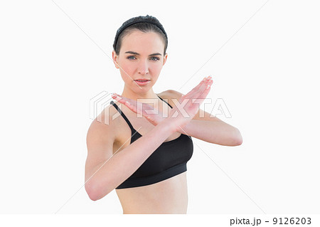 Fit young woman standing in defending posture Fit young woman standing in defending posture 9126203