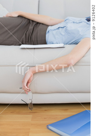 Mid section of slender classy businesswoman lying on couch sleep Mid section of slender classy businesswoman lying on couch sleep 9126402