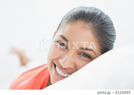 Pretty young woman resting in bed Pretty young woman resting in bed 9128895