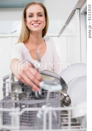 Lucky gorgeous model kneeling behind dish washer 9131910