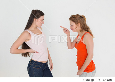 Angry young female friends having an argument Angry young female friends having an argument 9137386