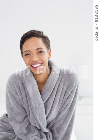 Portrait of a happy young female in bathrobe Portrait of a happy young female in bathrobe 9138195