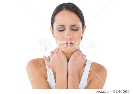 Close-up of a casual woman suffering from neck ache Close-up of a casual woman suffering from neck ache 9140006