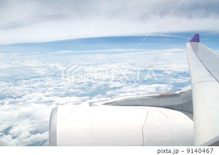 airplane engine and wing with sky 9140467