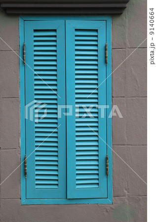 blue wood window on gray wall blue wood window on gray wall 9140664