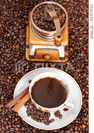 cup of coffee and roasted beans 9147434