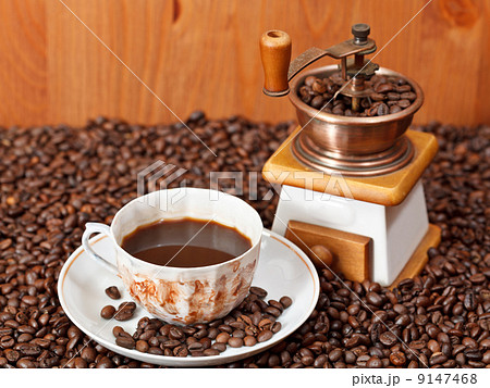 cup of coffee and roasted beans cup of coffee and roasted beans 9147468