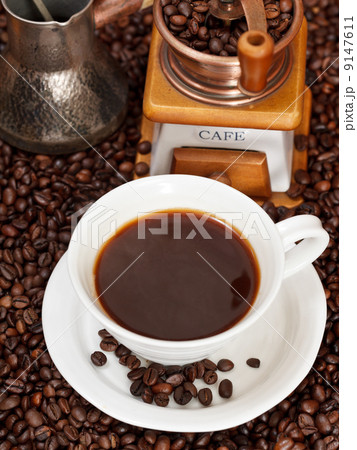cup of coffee and roasted beans 9147611