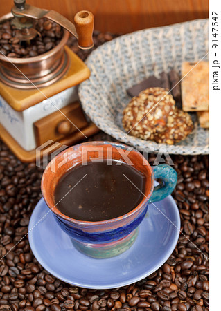 cup of coffee and roasted beans 9147642