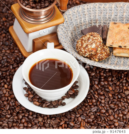 cup of coffee and roasted beans 9147643