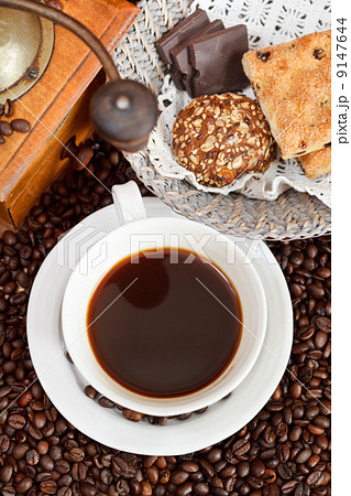 cup of coffee and roasted beans 9147644