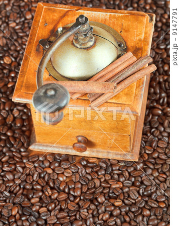 retro manual coffee mill on roasted beans retro manual coffee mill on roasted beans 9147791