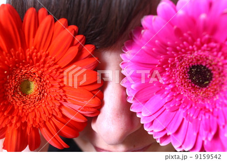 Young blond woman with flowers in her hands Young blond woman with flowers in her hands 9159542