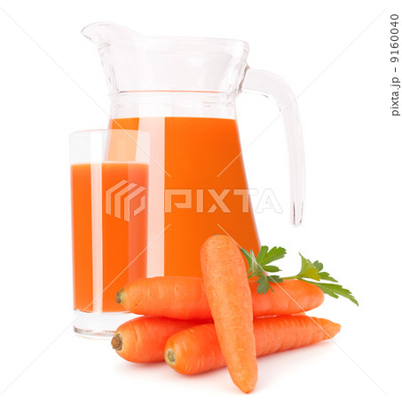 Carrot vegetable juice in glass jug Carrot vegetable juice in glass jug 9160040