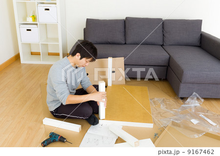 Man assembling cupboard 9167462