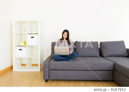 Asian woman using notebook at home 9167952