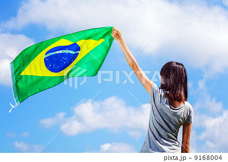 Woman holding a brazil flag Woman holding a brazil flag 9168004