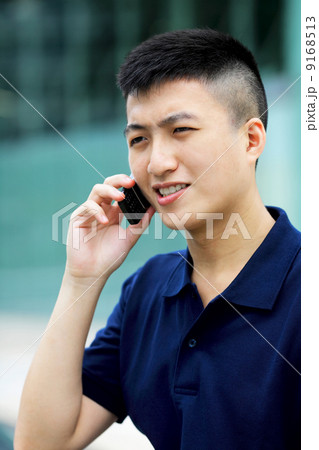 asian man with cell phone asian man with cell phone 9168513