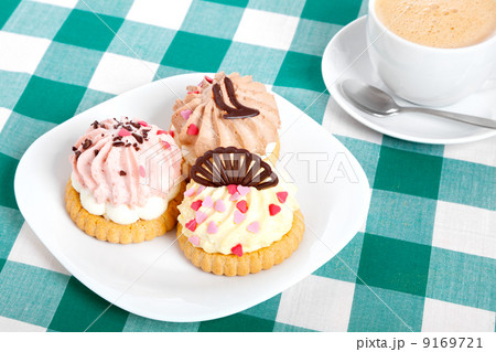 three cake on tablecloth. Coffee cup 9169721