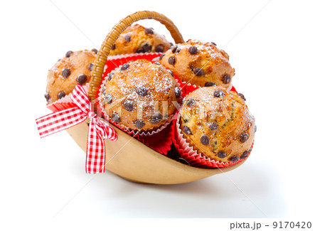 Muffins in a basket isolated on white background Muffins in a basket isolated on white background 9170420