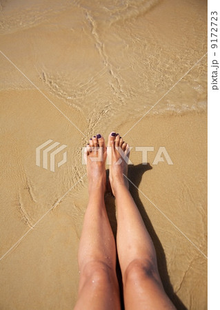legs in ocean at Conil beach 9172723