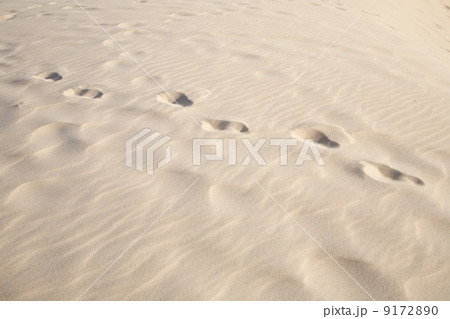 one person footprints on sand 9172890