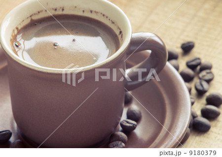 Cup of Coffee with beans on wood background 9180379