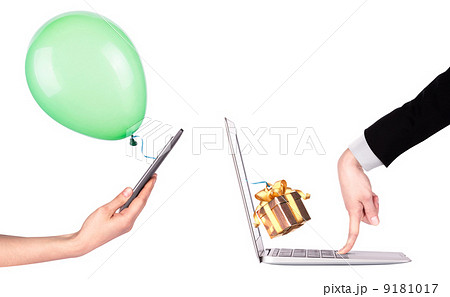 hand with a gift and laptop 9181017