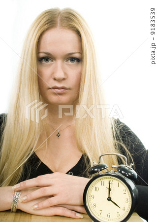 blond woman with clock 9183539