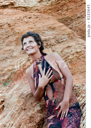 brunet woman in brown dress brunet woman in brown dress 9183645
