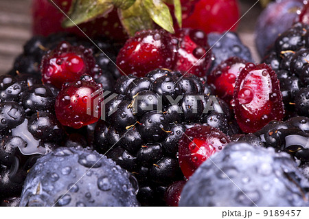 tasty summer fruits on a wooden table 9189457