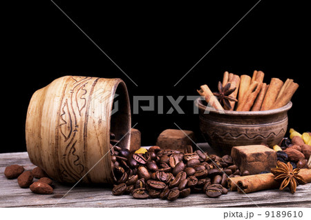 Chocolate bar and spices on wooden table Chocolate bar and spices on wooden table 9189610