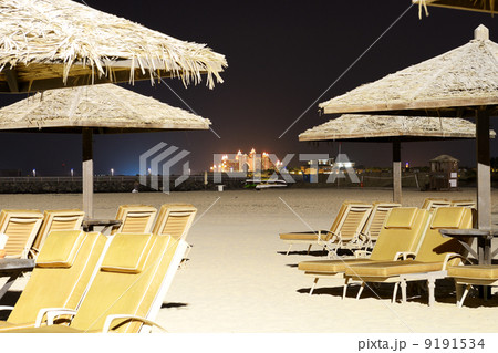 Beach night illumination with a view on Palm Jumeirah, Dubai, UA Beach night illumination with a view on Palm Jumeirah, Dubai, UA 9191534