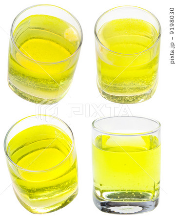 glass of yellow carbonated water with vitamin glass of yellow carbonated water with vitamin 9198030