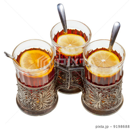 retro glasses in silver glass holders with black tea retro glasses in silver glass holders with black tea 9198688