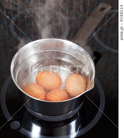 boiling chicken eggs in metal pot 9199214