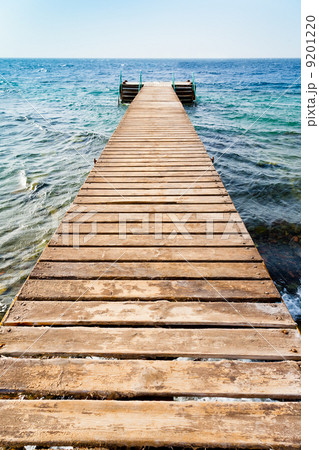 wooden pier on coast of Coral beach 9201220