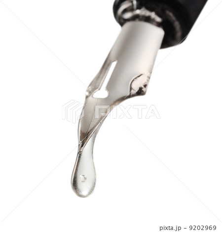 transparent drop dripping from the nib of pen 9202969