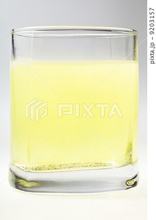 glass of yellow carbonated water glass of yellow carbonated water 9203157