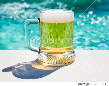 glass of cold beer in hot summer day 9203331