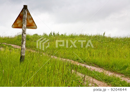 old rusty traffic sigh on cross-country road 9204644