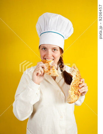 baker is eating fresh loaf baker is eating fresh loaf 9206457